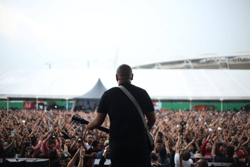 Zahid performing with band mates Disagree at Rock The World 2016