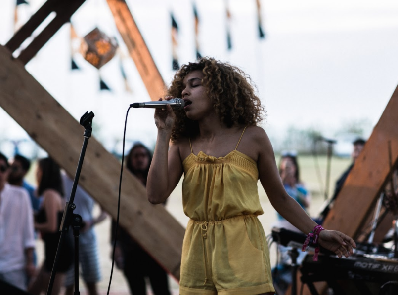 With Blockchain, fans can purchase an album with existing cryptocurrencies such as Bitcoin and Ethereum and will be able to collect crypto rewards in the form of “Audio coins” when engaging in social media interactions." Image courtesy of Wonderfruit, Izzy Bizu.