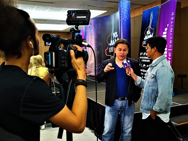 Norman Halim, a member of rock group KRU, is now festival director of KL Jamm answering questions from the press.