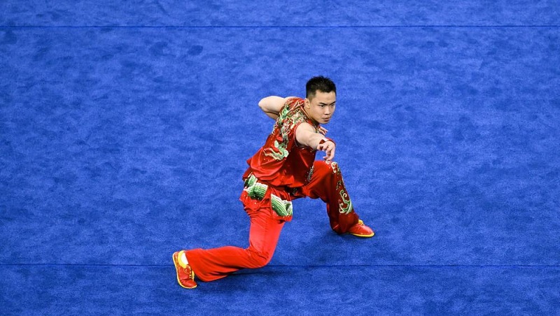 Cao Maoyuan of China competes in the wushu men's nanquan.Photo by Wang Xi. Music Press Asia